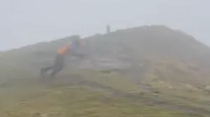 Man tries to walk in 115 mph winds