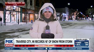 Snow squalls, dangerous travel continue after blizzard brought feet of snow to Michigan