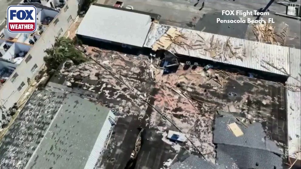 Buildings in Pensacola Beach were significantly damaged during Hurricane Isaias on Friday. Hurricane-force winds upwards of 100 mph slammed the city, ripping roofs off of buildings and tossing them yards away. Drone footage shows some of the damage.
