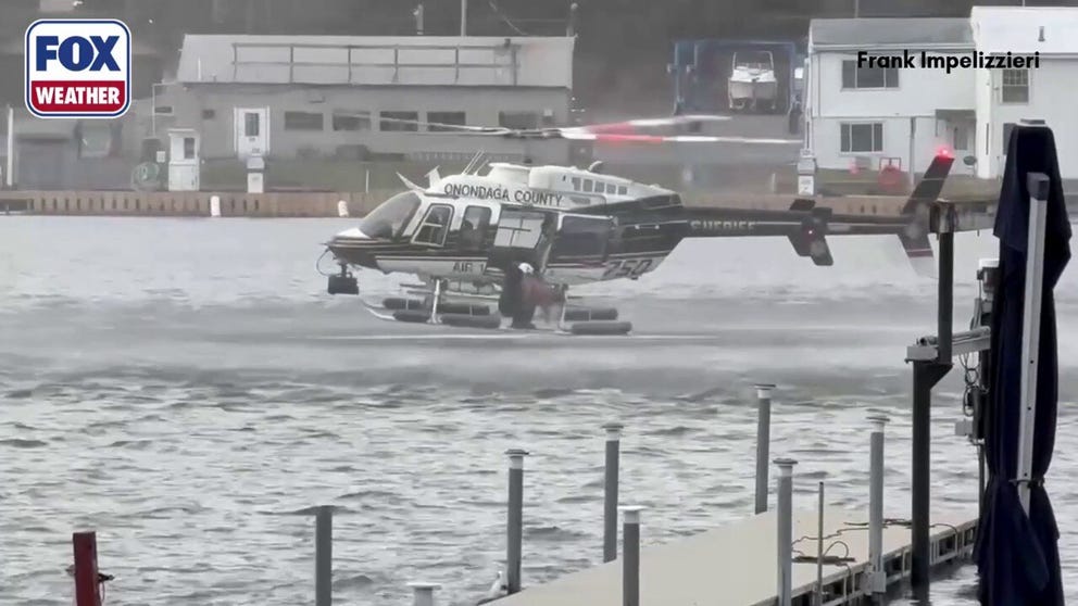A goldendoodle was pulled from the frigid Seneca River after struggling to stay afloat Monday. Officials carried out a skid rescue and rushed the trembling pup to safety, where firefighters were waiting with blankets.