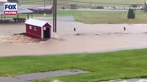 Watch: Torrential rain inundates southern Indiana, turns Lanesville street into river 
