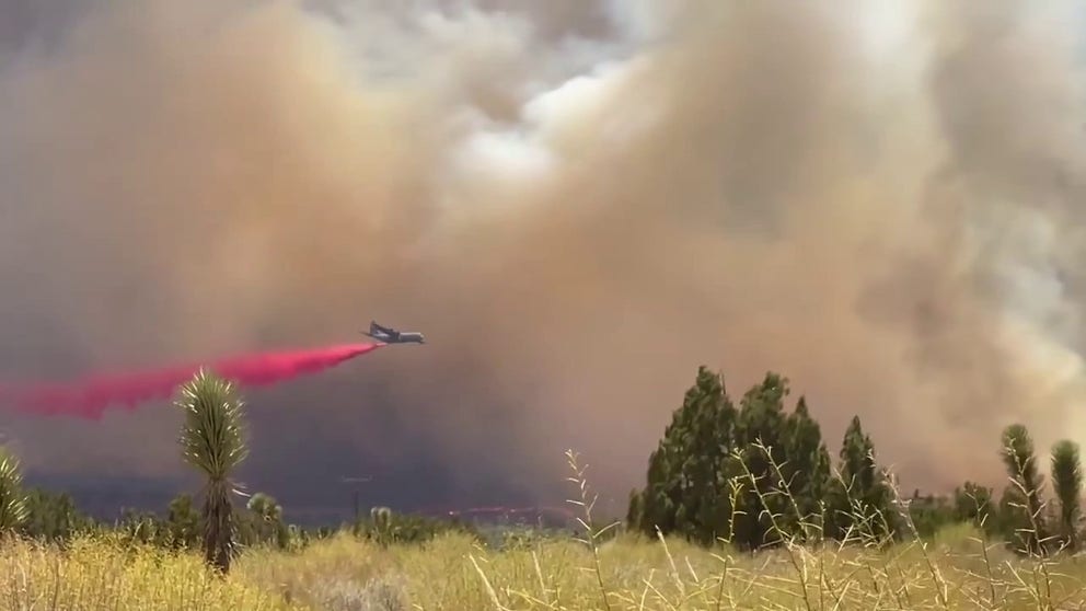Military C-130 Modular Airborne FireFighting System (MAFFS) airtankers with an Aerial Quick Strike mission drop fire retardant on the Summit Fire in Los Angeles County, California, providing critical surge capacity as firefighters battle the fast-moving wildfire.
