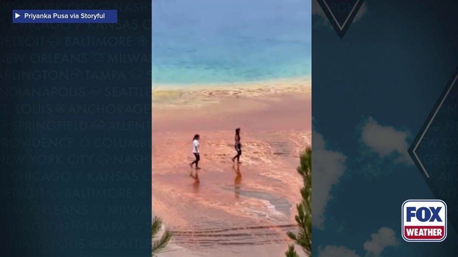 See it: Tourists filmed walking illegally close to dangerous Yellowstone hot spring