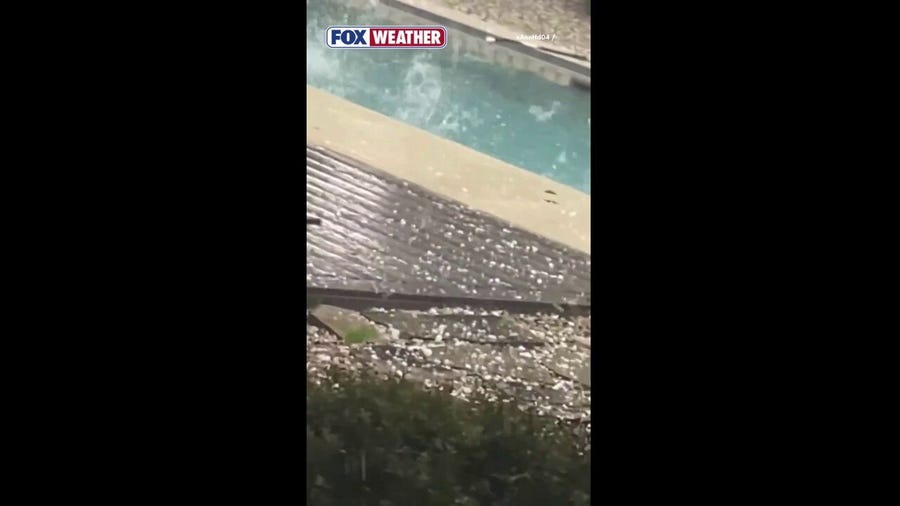 Massive amounts of hail splash down into a pool in Texas
