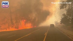 Large flames burn alongside road in Spokane, Washington