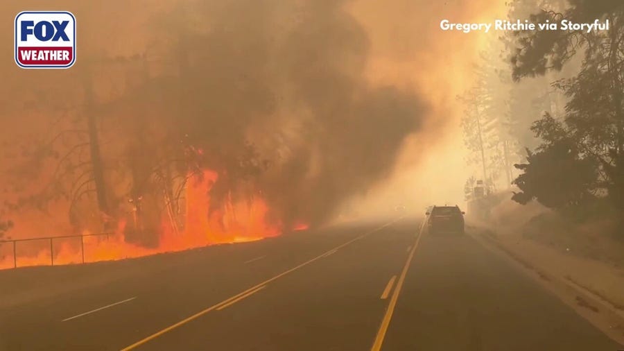 Large flames burn alongside road in Spokane, Washington