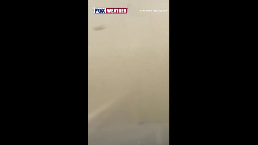 Blizzard-like dust storm reduces visibility on North Dakota highway