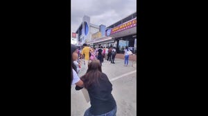 Children and parents are rushed out of a school after earthquake rattles Davao City