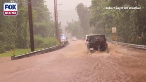 Watch: Ride along with Correspondent Robert Ray as he navigates Oahu after devastating flooding