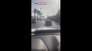 See it: Vehicles drive through flooded streets of Newport Beach, California, as Tropical Storm Rachel nears West Coast