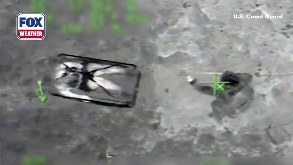 Video shows the moment U.S. Coast Guard crews rescued two people that were stranded at the bottom of a shoreside cliff in Puerto Rico on Saturday, March 28, 2026.