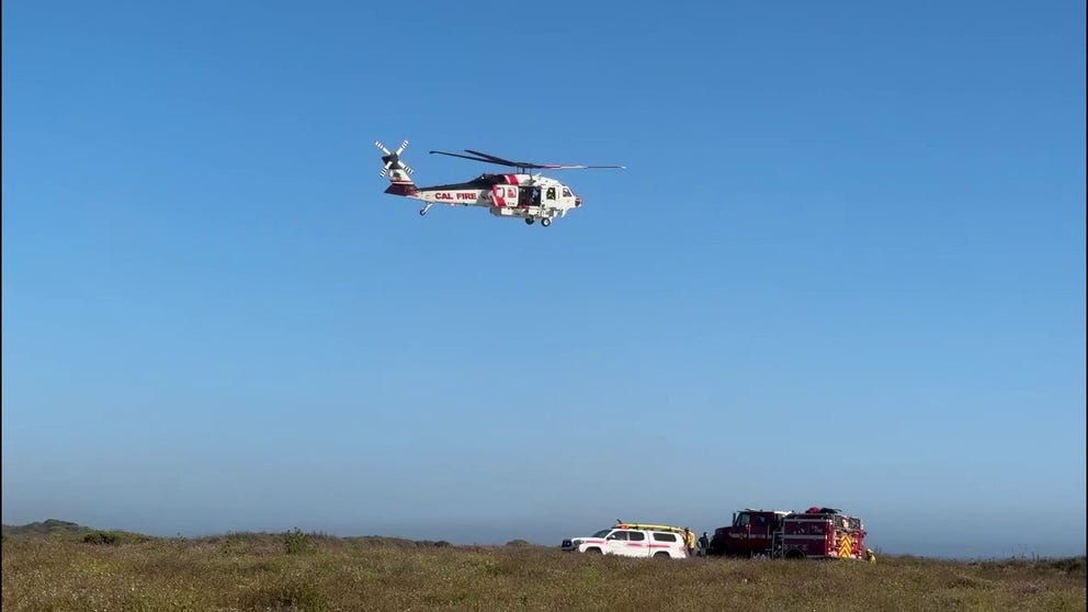 A helicopter transports on individual to Yellow Bank Beach before they are taken to a local hospital.