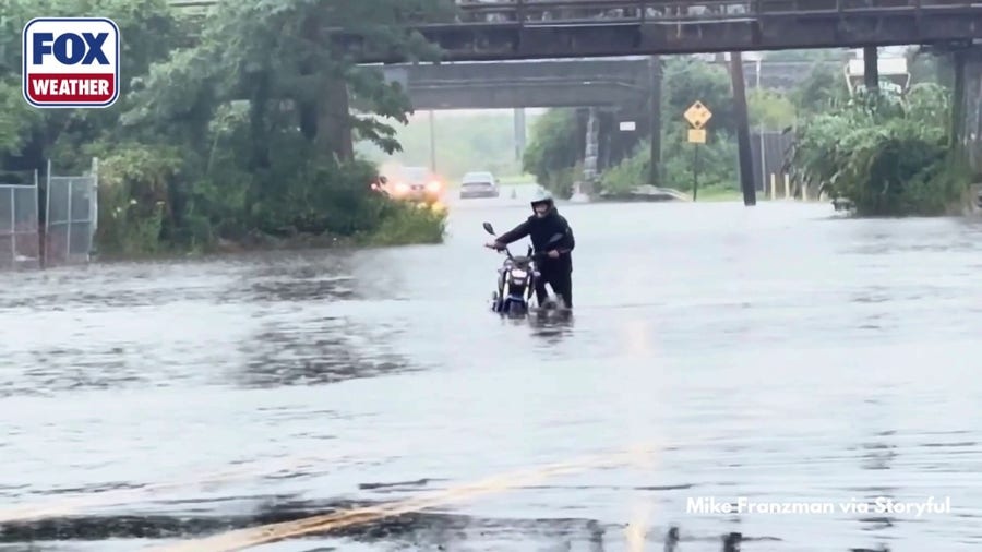 Drivers navigate Sunday flash flooding in New Haven, Connecticut