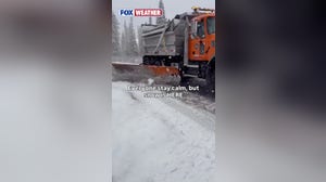 Snowplow clears roads during October snowstorm in Utah
