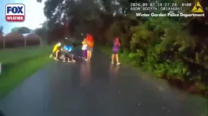 Watch: Police assist Florida couple struck by lightning on walk