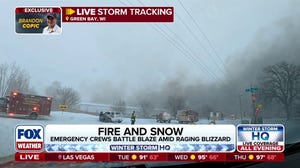 Emergency crews battling fire amid Blizzard conditions in Green Bay, Wisconsin