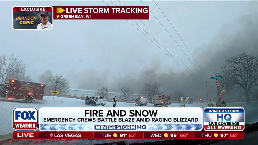 Emergency crews battling fire amid Blizzard conditions in Green Bay, Wisconsin