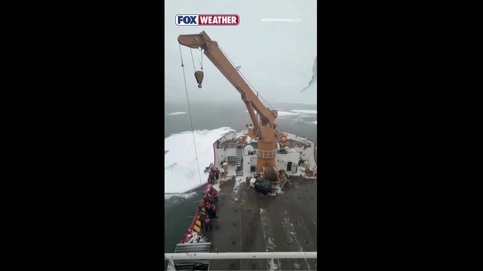 Members of the U.S. Coast Guard used an Icebreaker vessel to reach and extract a stranded snowmobile operator in Michigan this week.