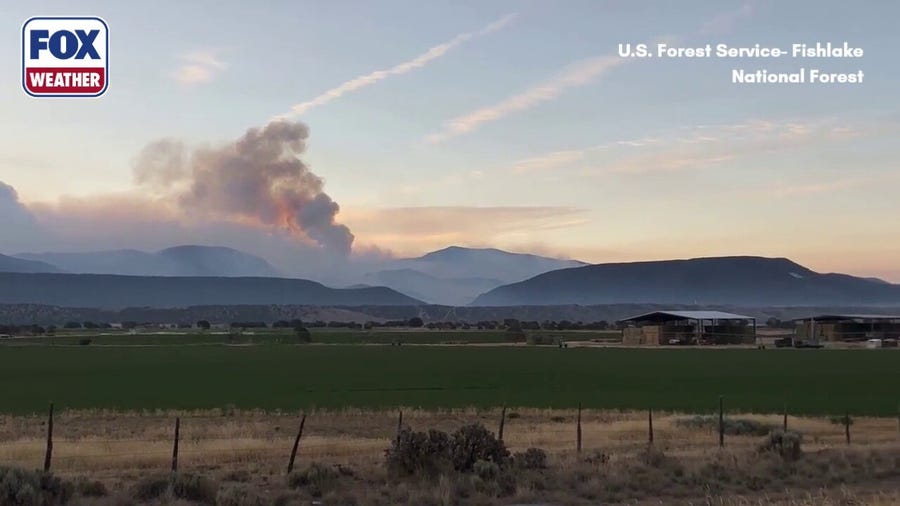 Smoke rises through Utah mountains amid massive Cottonwood Fire