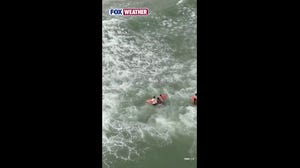 Floatation deployed from drone keeps swimmers afloat before rescuers could assist them safely to New York City beach