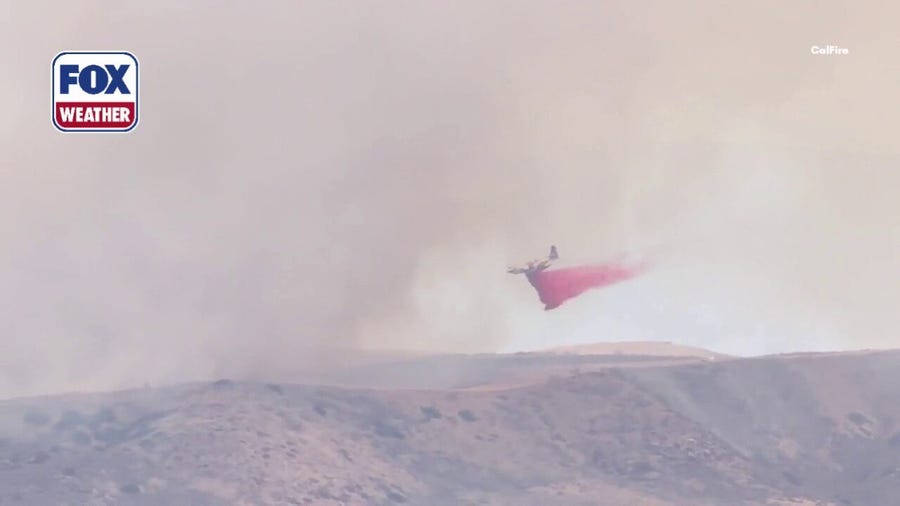 CalFire air tanker fights wildfire on U.S. Military Base