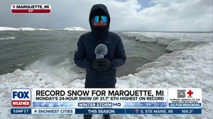 Lake Superior shoreline coated in ice following historic blizzard in Michigan