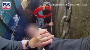 Massachusetts police officers rescue a fisherman who fell in freezing waters