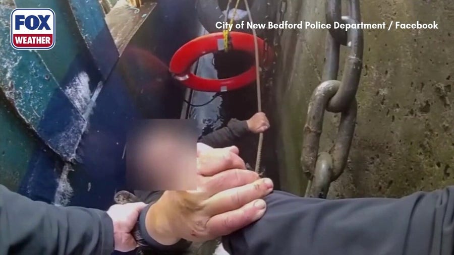 Massachusetts police officers rescue a fisherman who fell in freezing waters