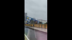 Signs whipped by wind as Typhoon Champi nears Taiwan