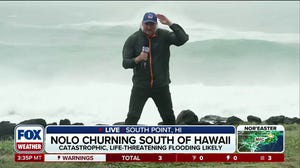 Hurricane Nolo moving just south of Hawaii, churning up strong winds and massive waves