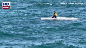Teenager rescued from capsized boat after days in frigid waters