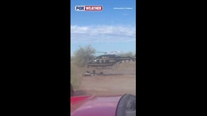 Driver becomes stuck in strong floodwaters requiring a rescue