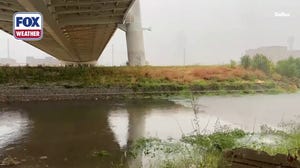Timelapse: Heavy rain moves over Trinity River in Dallas