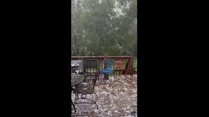Large hail batters a home in Missouri during a severe weather event