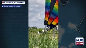 See it: Wind-tossed hot air balloon slams into California casino and power line before safely landing 