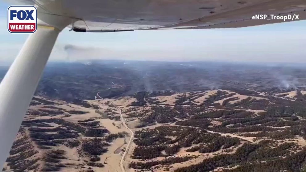 Video from the Nebraska State Patrol shows a helicopter flying over a wildfire in Dawson County. Multiple wildfires are burning in Nebraska as high winds and low humidity create critical fire danger across the state. 
