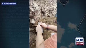 Scientists collect samples from Kilauea volcano summit crater