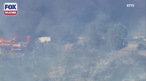 The Palos Fire in California engulfs a residence in flames