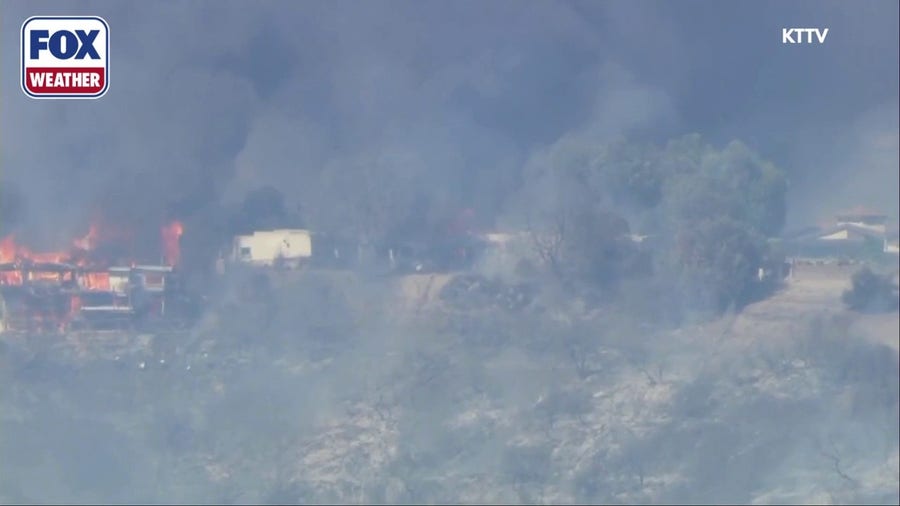 The Palos Fire in California engulfs a residence in flames