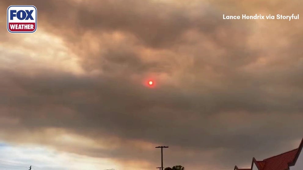 Watch as smoke billows over Naples, Florida, partially blocking out the sun Monday amid a wildfire that broke out near I-75 in Collier County.