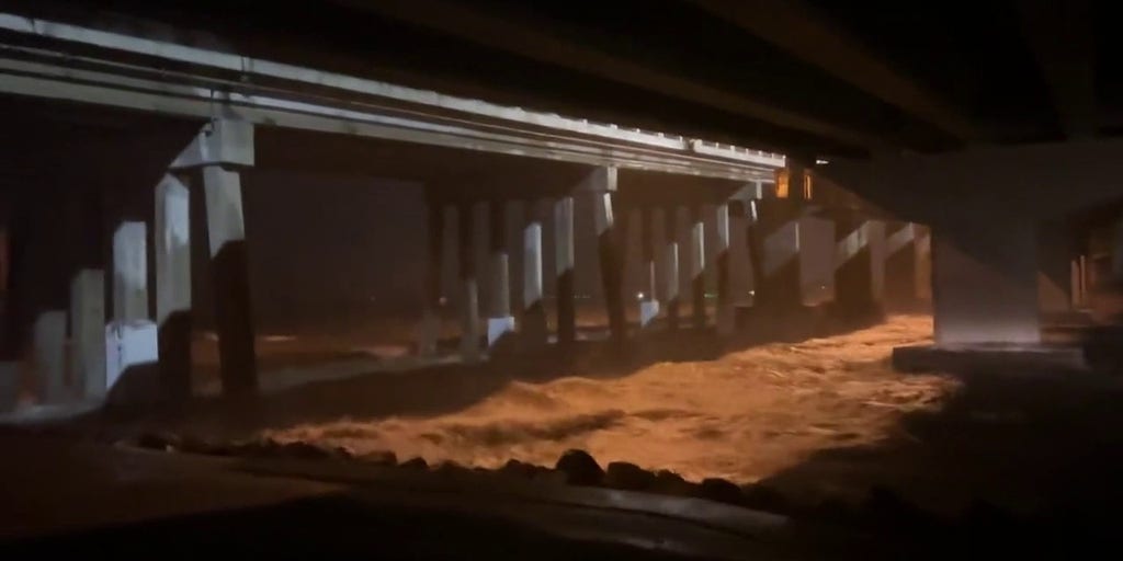 Water from Hurricane Ian rushes under Jolley Bridge in Marco Island