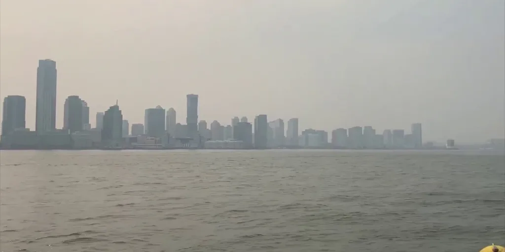 Manhattan is seen from Yankee Stadium through a haze of smoke before a  baseball game between the Philadelphia Phillies and the New York Yankees,  Wednesday, July 21, 2021, in New York. Wildfires