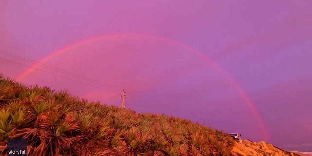 Watch: Pink clouds and rainbows stretch across Florida sky
