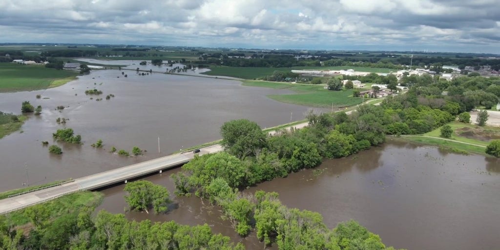 Watch: Drone video shows cars driving over Iowa bridge as flooding occurs below | Latest Weather Clips | FOX Weather