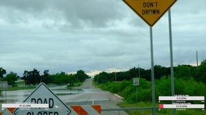 Driver ignores 'turn around don't drown' sign