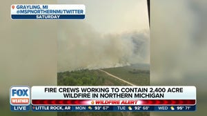 Fire crews make progress in containing massive wildfire burning in Michigan