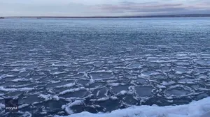 Pancake ice float on Lake Superior as temperatures plunge to zero