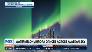Watermelon aurora dances across the Alaskan sky