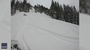 Video shows snowmobiler buried by Wyoming avalanche