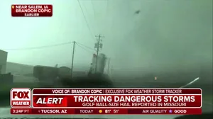 Exclusive video: Apparent tornado sends silo toward storm chaser